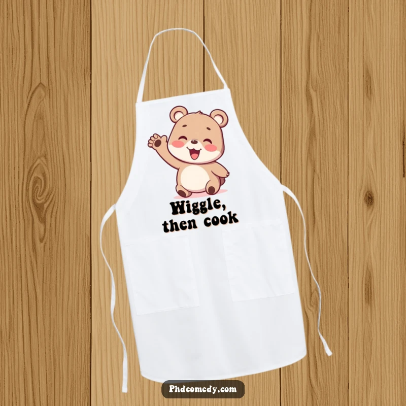Funny playful kawaii bear cub enthusiastically gesturing with a silly wiggly arm, on a kitchen apron.