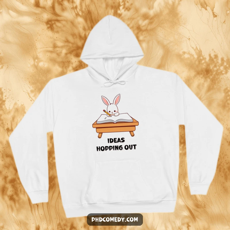 Funny determined kawaii rabbit diligently scribbling on a giant notepad with a tiny pencil, on a hoodie.