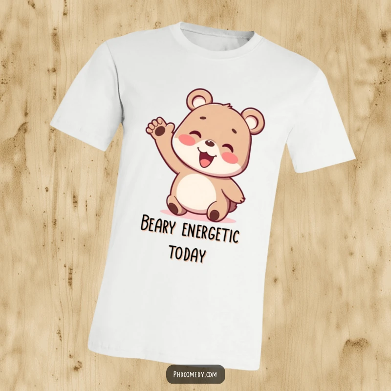 Funny playful kawaii bear cub doing a silly, energetic wiggle with one arm on a t-shirt.
